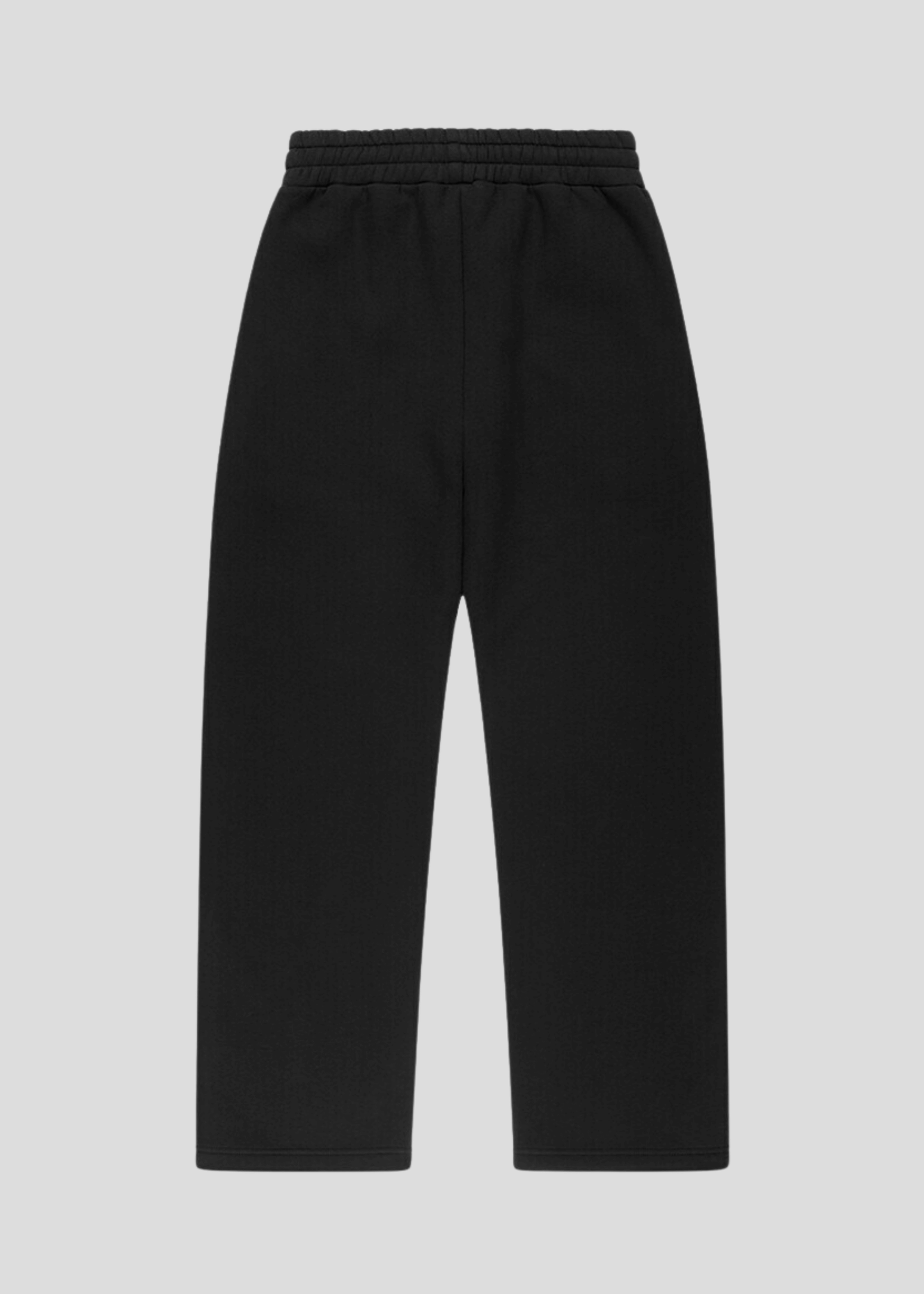 Side view of premium heavyweight black sweatpants with MAXOMclo graffiti print – loose fit, streetwear look.