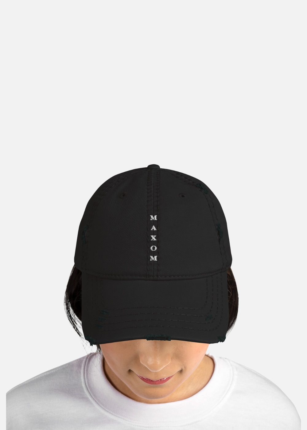 Female model in vintage-style black distressed cap – low-profile urban fashion hat for everyday comfort and bold streetwear looks.
