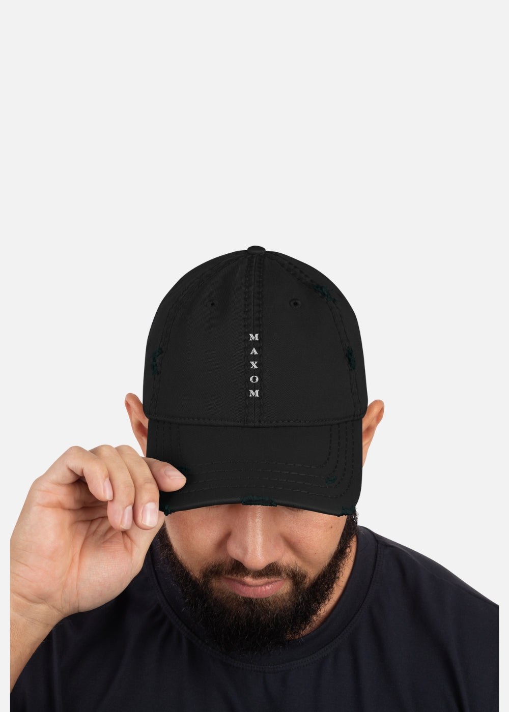 Male model wearing black distressed streetwear cap – frayed brim, breathable cotton fabric, and bold vintage look for casual and festival fashion.