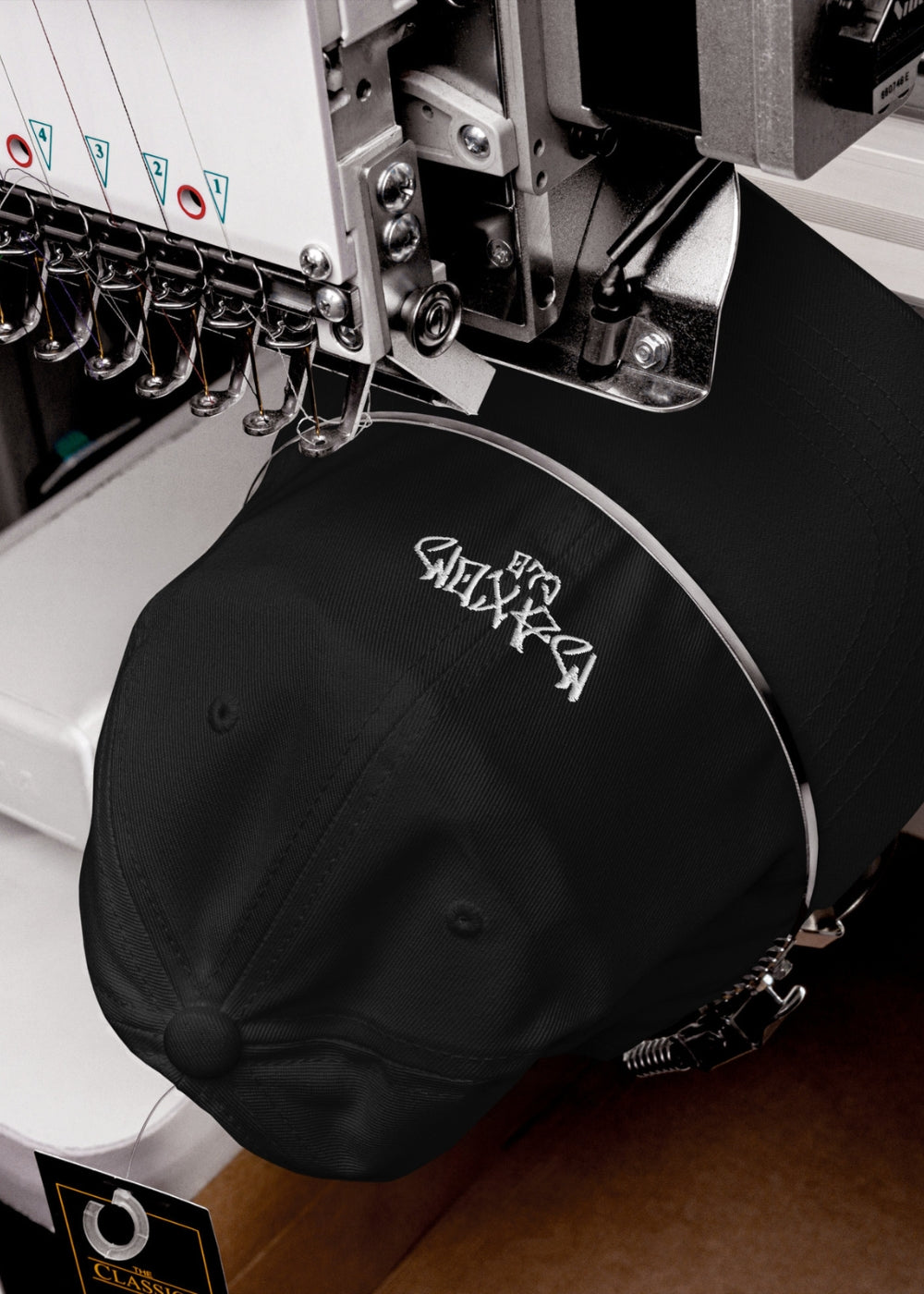 Black Skullflow premium low-profile cap in production – chino cotton material with attention to minimalist streetwear detail.