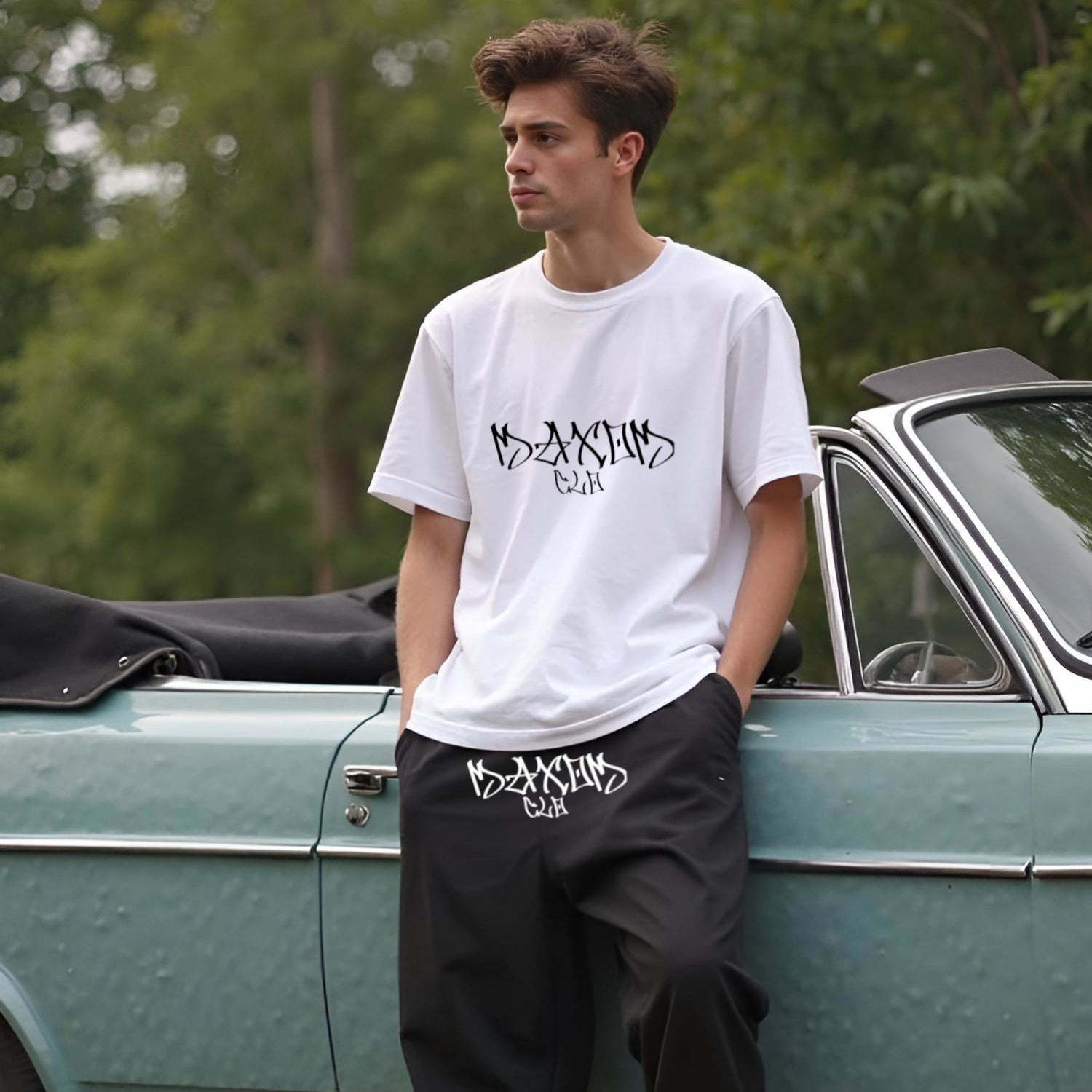 Male model wearing Skullflow Oversized T-Shirt and Baggy Sweatpants by MAXOMclo – unisex streetwear outfit in oversized style for Gen Z fashion lovers