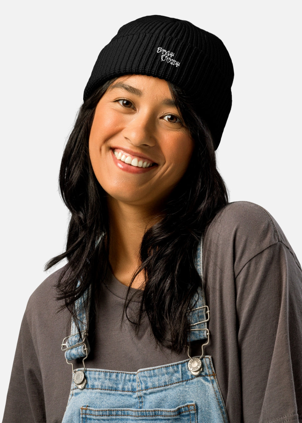 Female model wearing black streetwear beanie – ribbed urban knit hat with bold cross detail by MAXOMclo