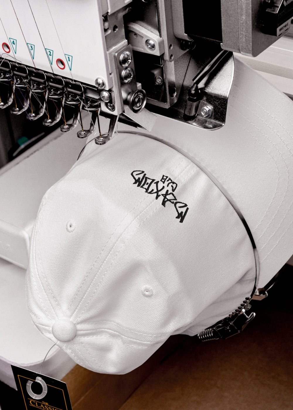 White Skullflow premium low-profile cap being crafted – chino cotton streetwear cap with clean lines and minimal form.