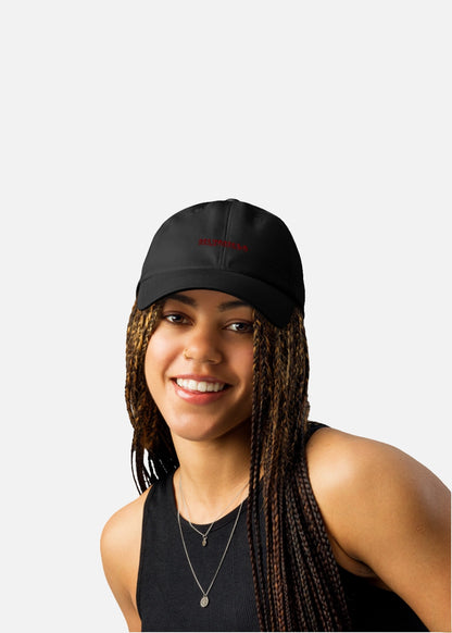 Female model styled with a black performance streetwear cap – unisex low-profile design for casual wear.