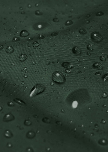 Green waterproof jacket close-up showing rain resistance – eco-friendly streetwear outerwear