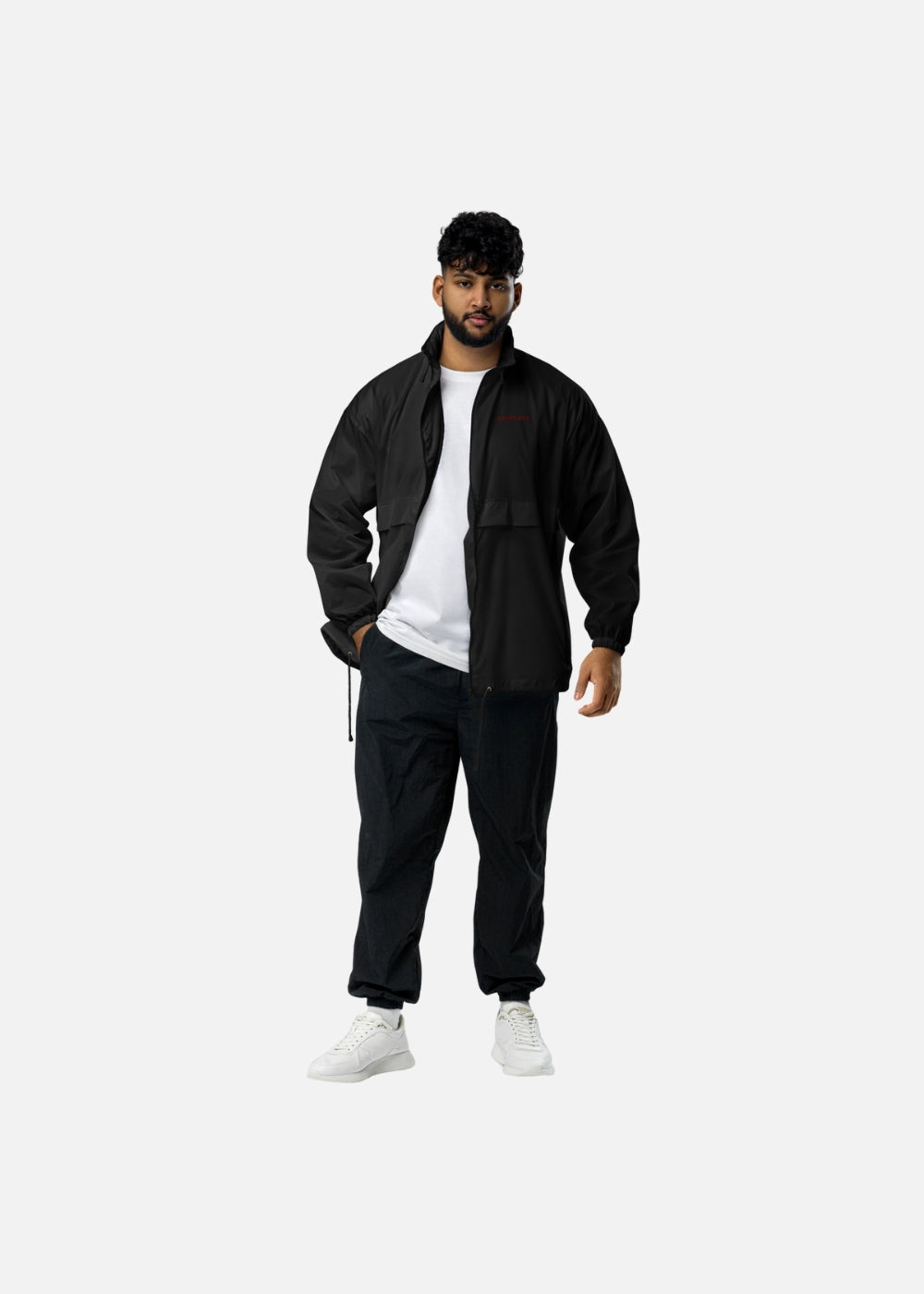 Man wearing black streetwear windbreaker jacket – urban outdoor look with waterproof performance