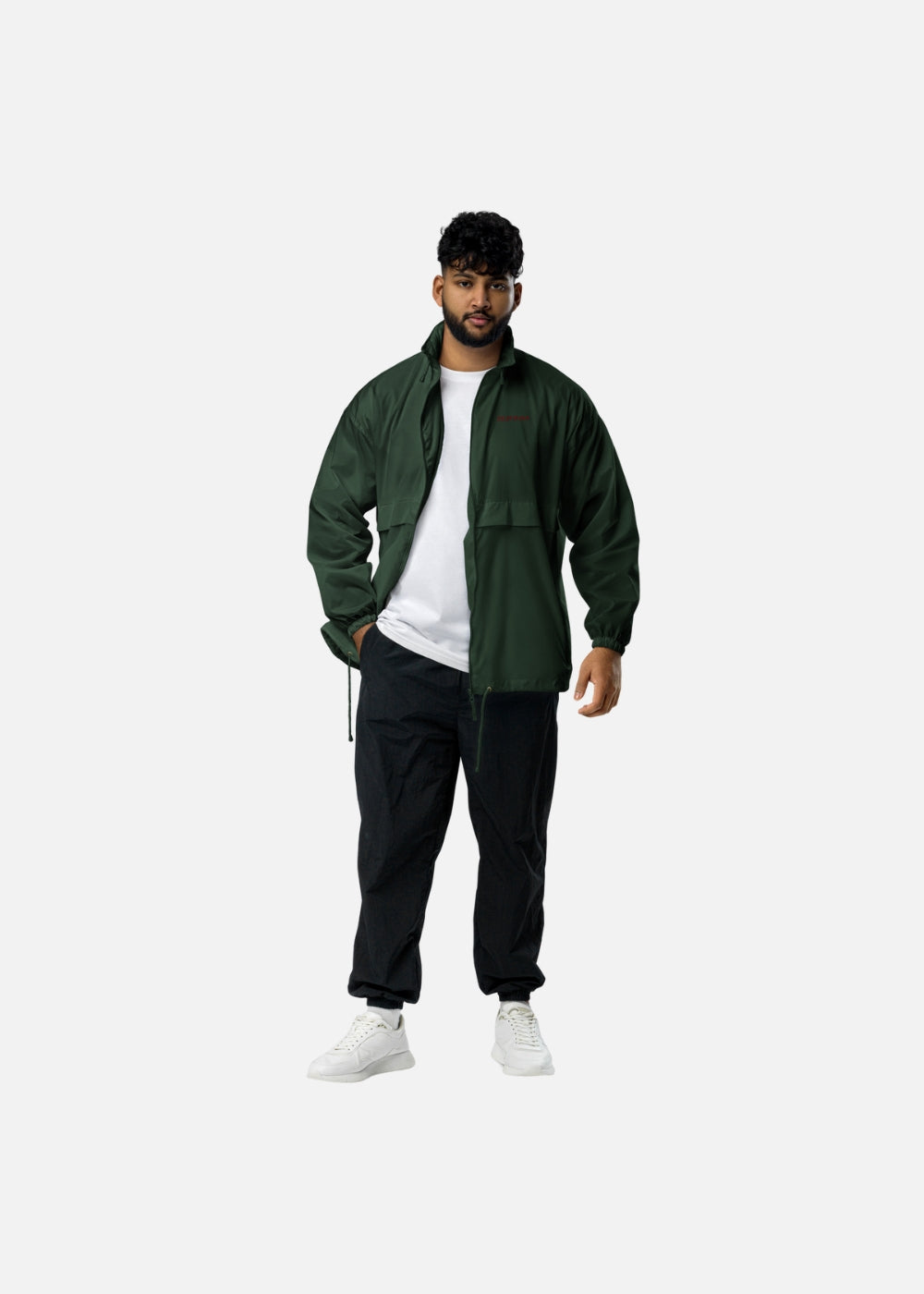 Urban male model wearing green windbreaker – breathable and ethical fashion jacket