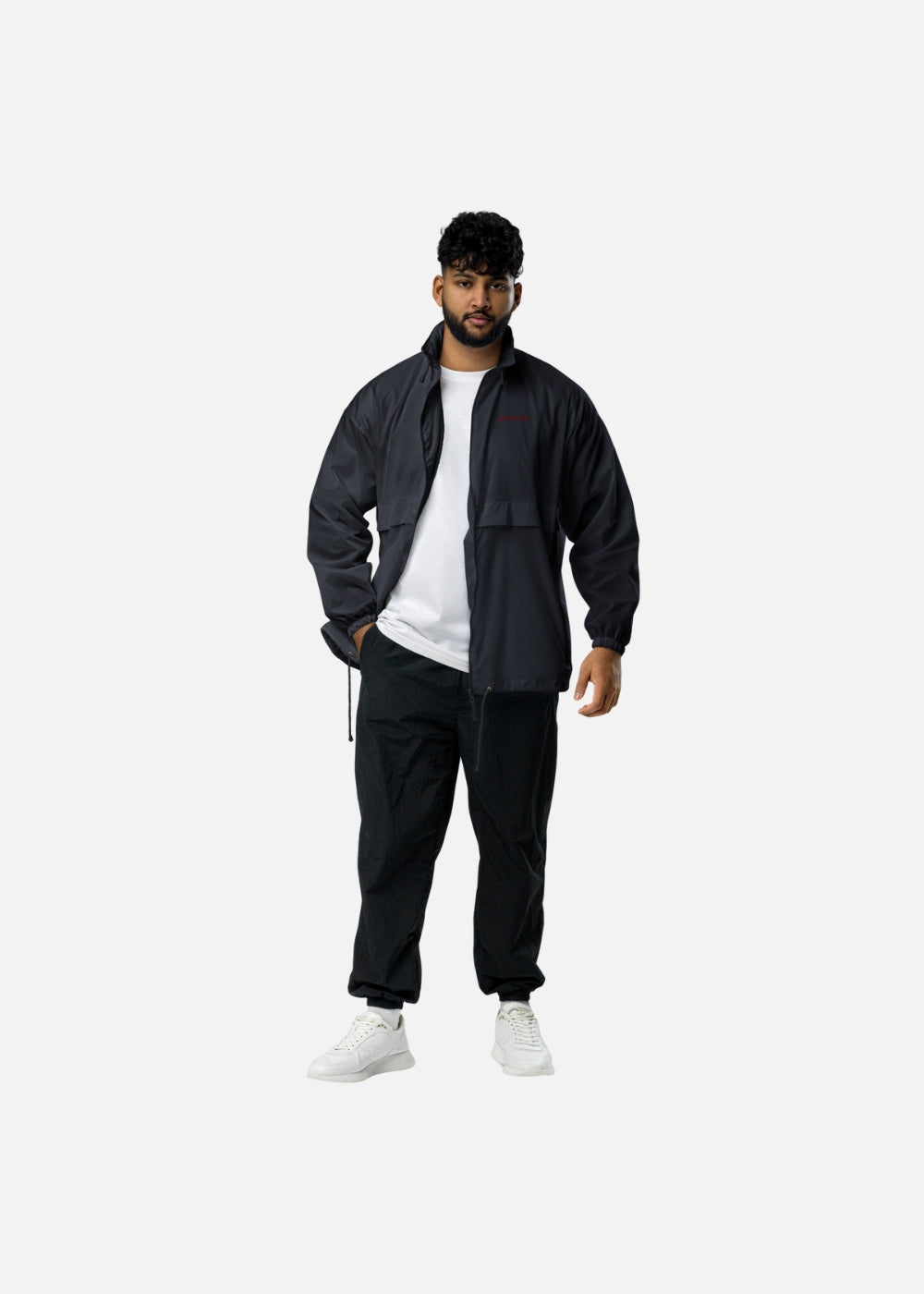 Male model wearing navy streetwear windbreaker – sustainable and stylish urban fashion jacket