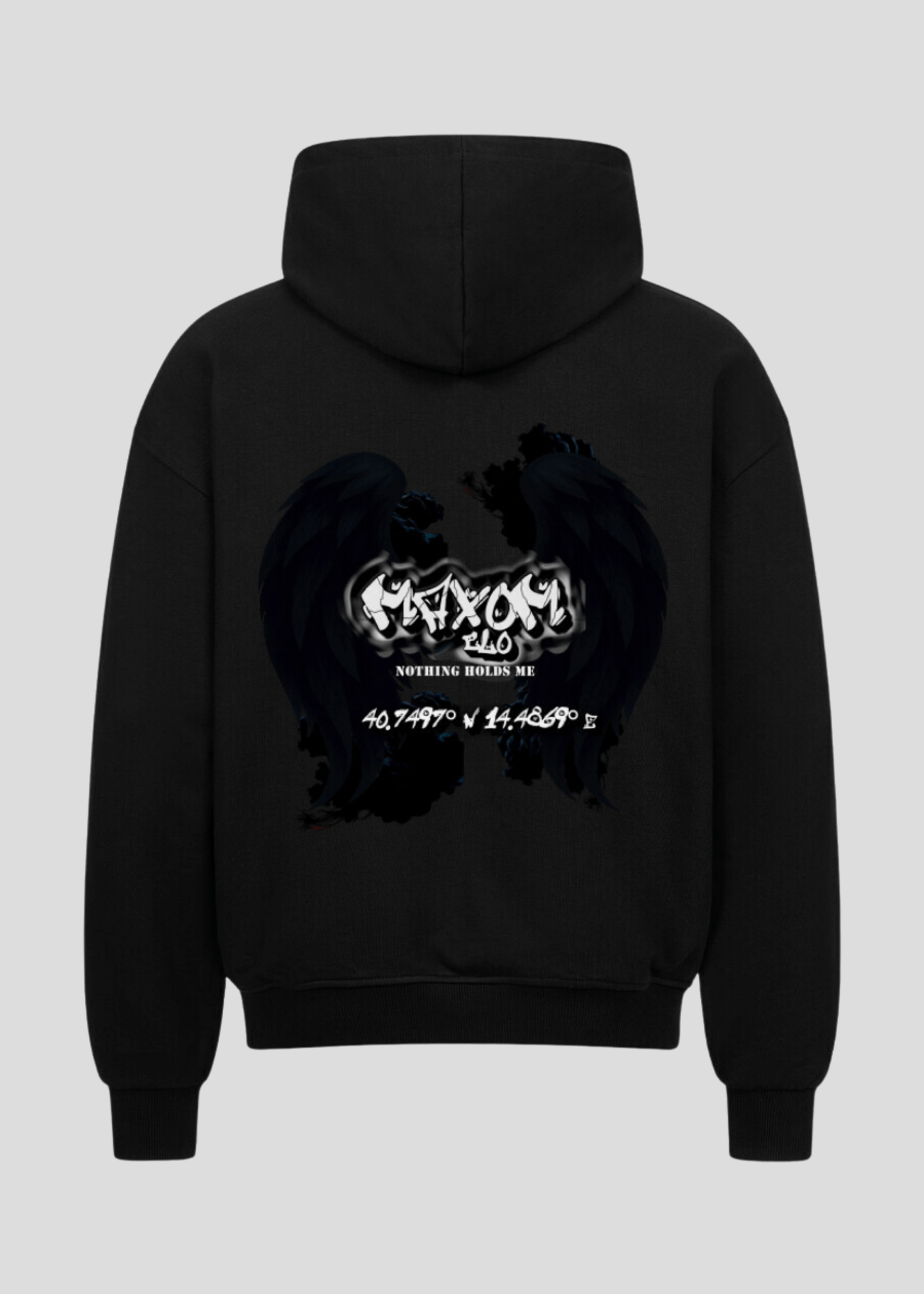 Oversized black streetwear hoodie with gothic angel wings and coordinates backprint – “Nothing Holds Me” motivational slogan in grunge style.