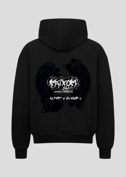 Oversized black streetwear hoodie with gothic angel wings and coordinates backprint – “Nothing Holds Me” motivational slogan in grunge style.