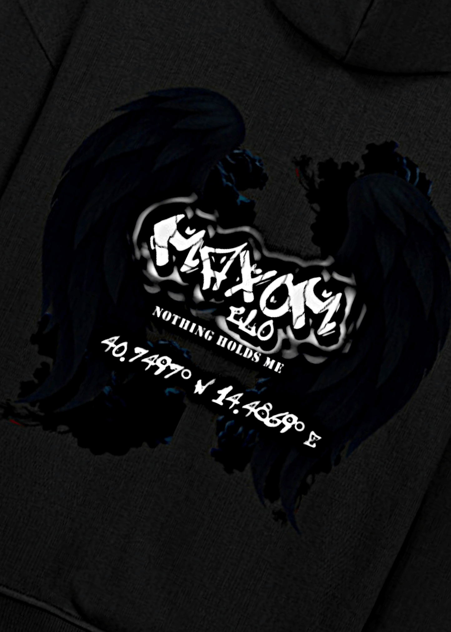 Detailed view of angel wings graphic and coordinates quote on edgy oversized hoodie – “Nothing Holds Me” streetwear inspiration.