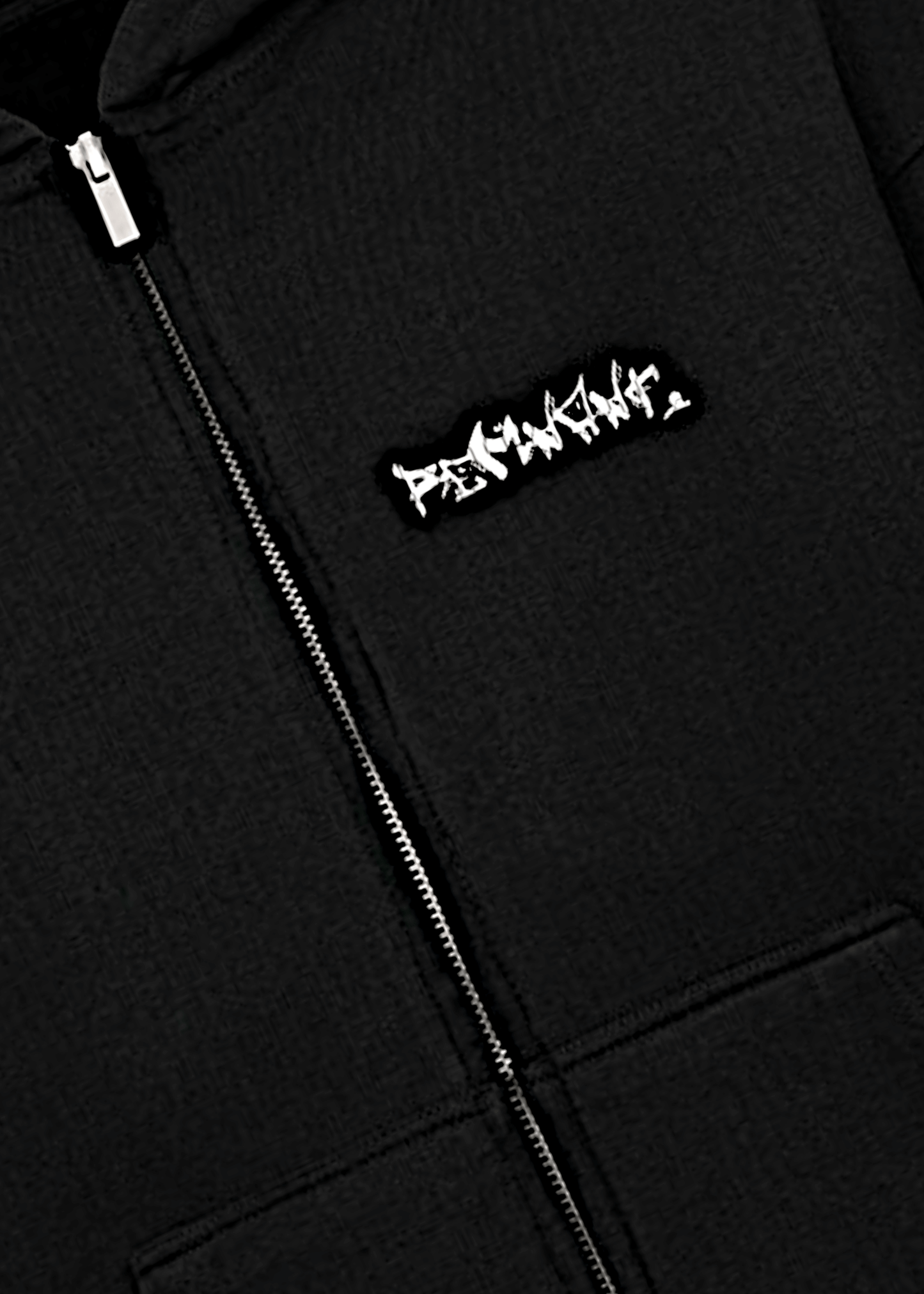 Close-up of REMNANT graffiti logo on premium zip up Turkish cotton hoodie – heavyweight 430 GSM fabric in black.