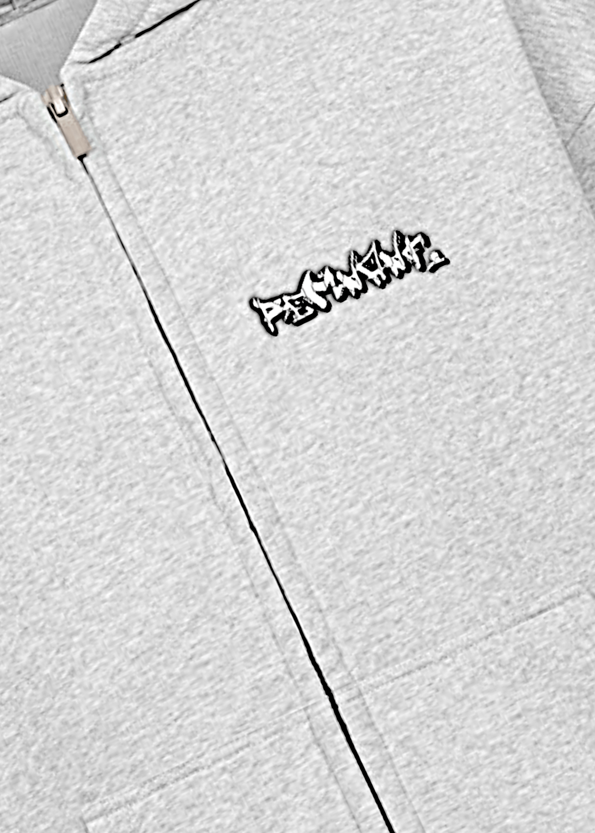 Zoomed front view of REMNANT graffiti logo on oversized light grey hoodie – no drawstring premium streetwear design.