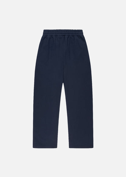 Back view of navy premium unisex sweatpants – minimalist baggy joggers with urban fit and ethically made in Türkiye.