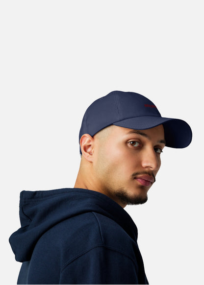 Male model wearing navy urban streetwear cap – Vietnam-made performance cap for summer fashion and active lifestyles.