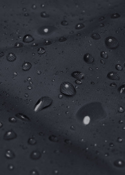 Water droplets on navy waterproof windbreaker – vegan and weather-resistant jacket material