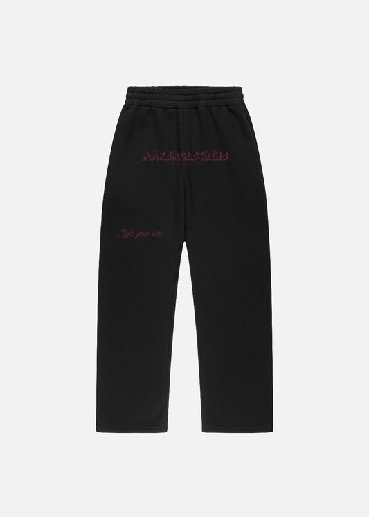 MAXOMclo Red Obsidian sweatpants in black with bold red lettering – front view of relaxed fit baggy pants for unisex streetwear lovers.

