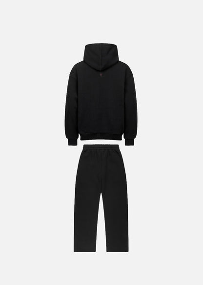 MAXOMclo Red Obsidian streetwear set – back view of oversized black hoodie with red print and relaxed baggy sweatpants. Bold and stylish 380 GSM cotton look.

