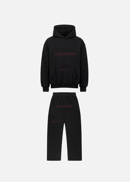 Front view of MAXOMclo Red Obsidian set with black hoodie and black baggy joggers. Premium unisex streetwear set in a bold red-on-black urban style.

