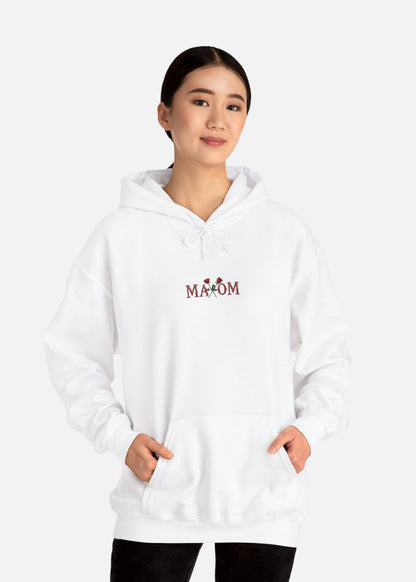 Female model wearing white rose motivational hoodie – minimalist streetwear for everyday style