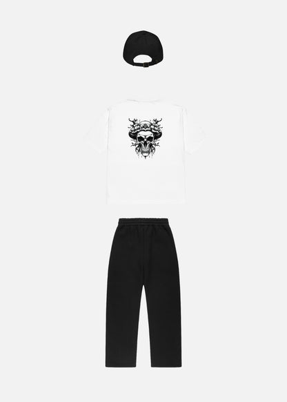 Rear view of Skullflow Essentials urban streetwear bundle with black cap – oversized t-shirt and baggy pants set for modern minimalist looks.

