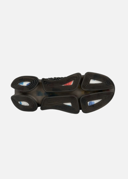 Grip-focused EVA sole of men’s black abstract sneaker – lightweight and ready for travel